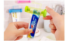Load image into Gallery viewer, Creative Rolling Toothpaste Squeezer