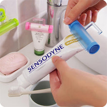Load image into Gallery viewer, Creative Rolling Toothpaste Squeezer